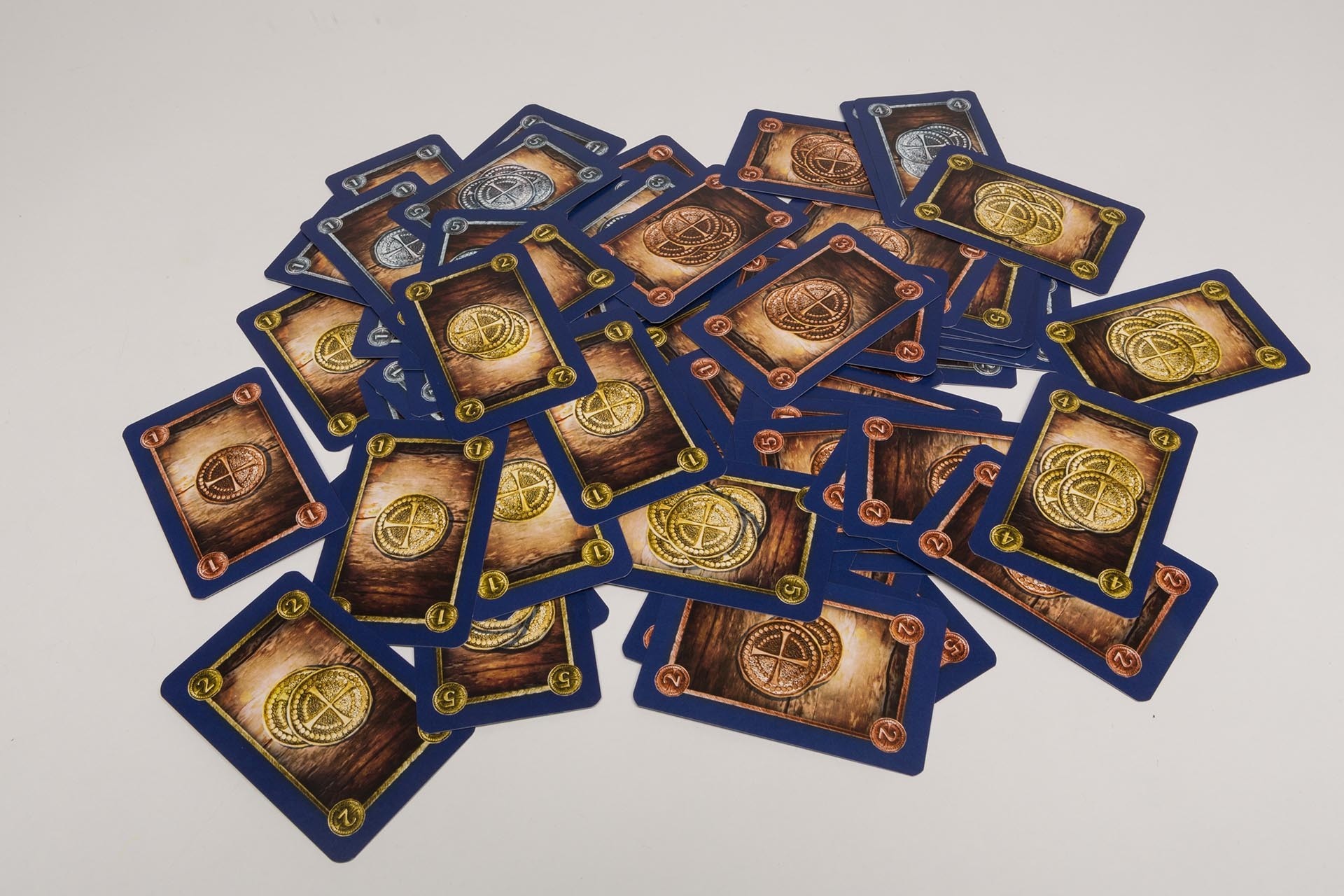 Playing cards with coin imprint